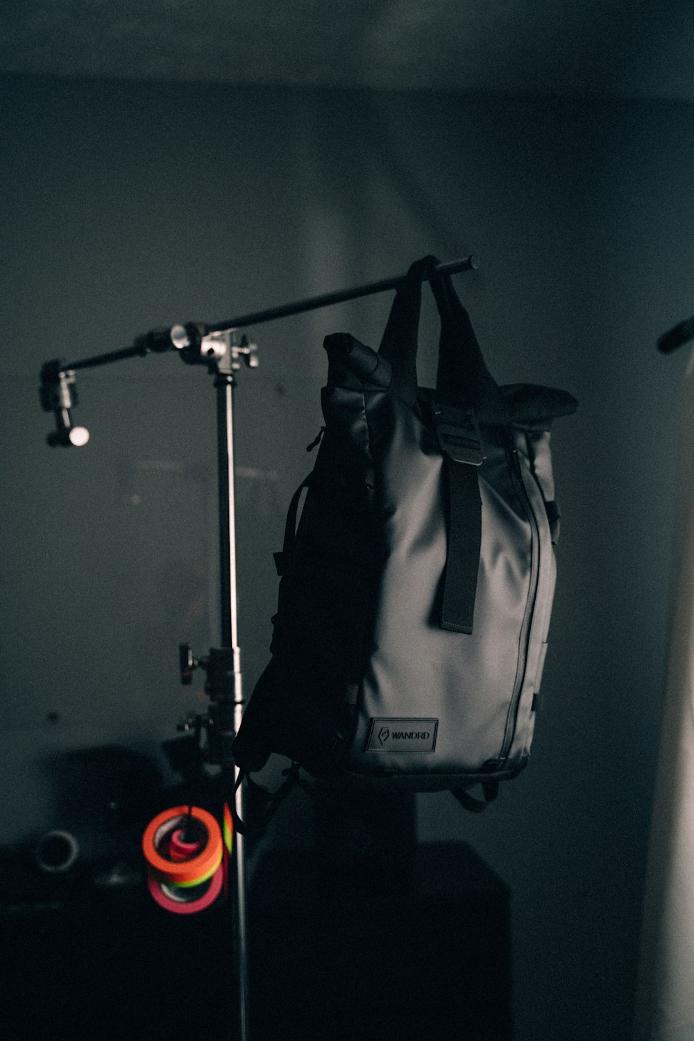 black backpack on rack