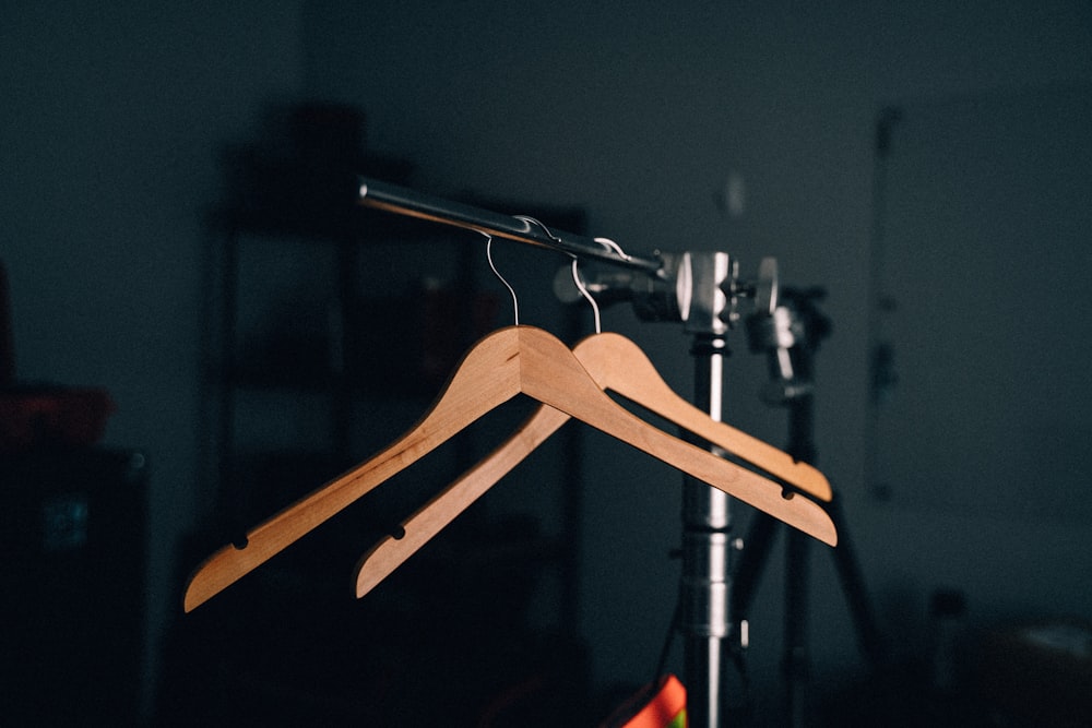 two brown clothes hangers