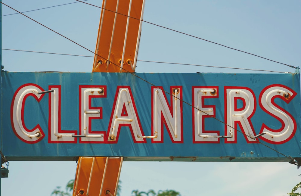 white and blue cleaners signage