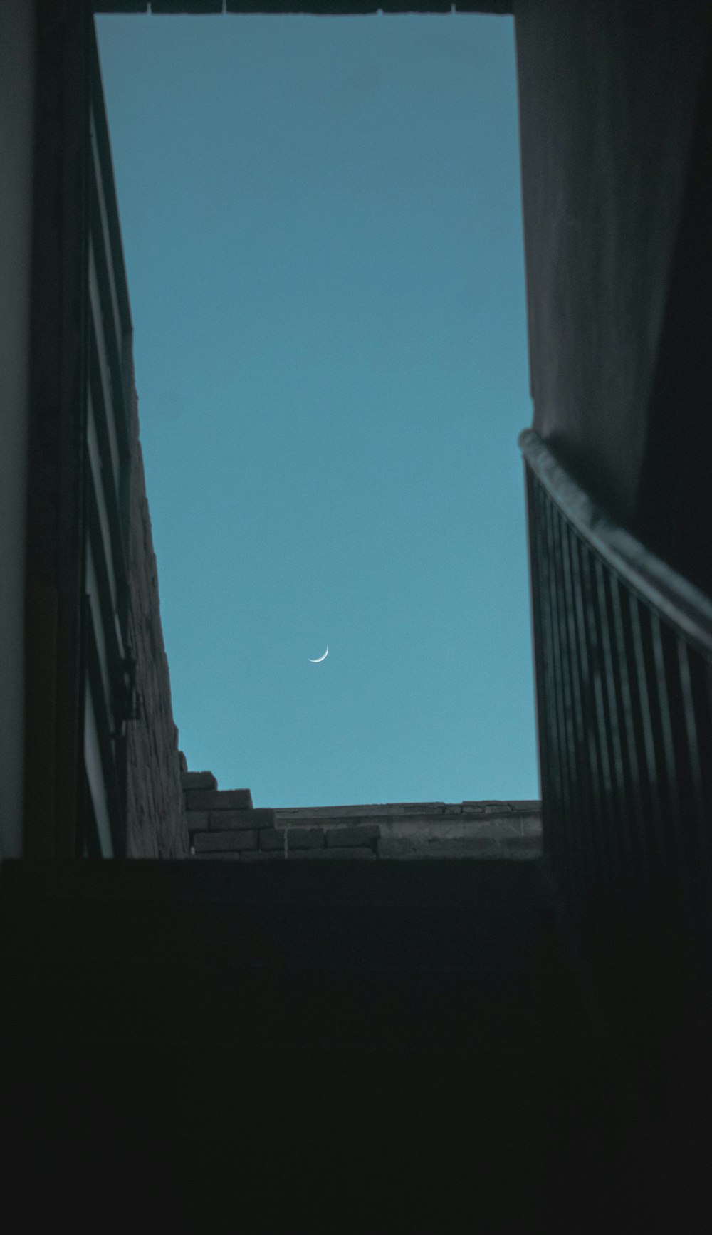 a view of the sky from a stairwell