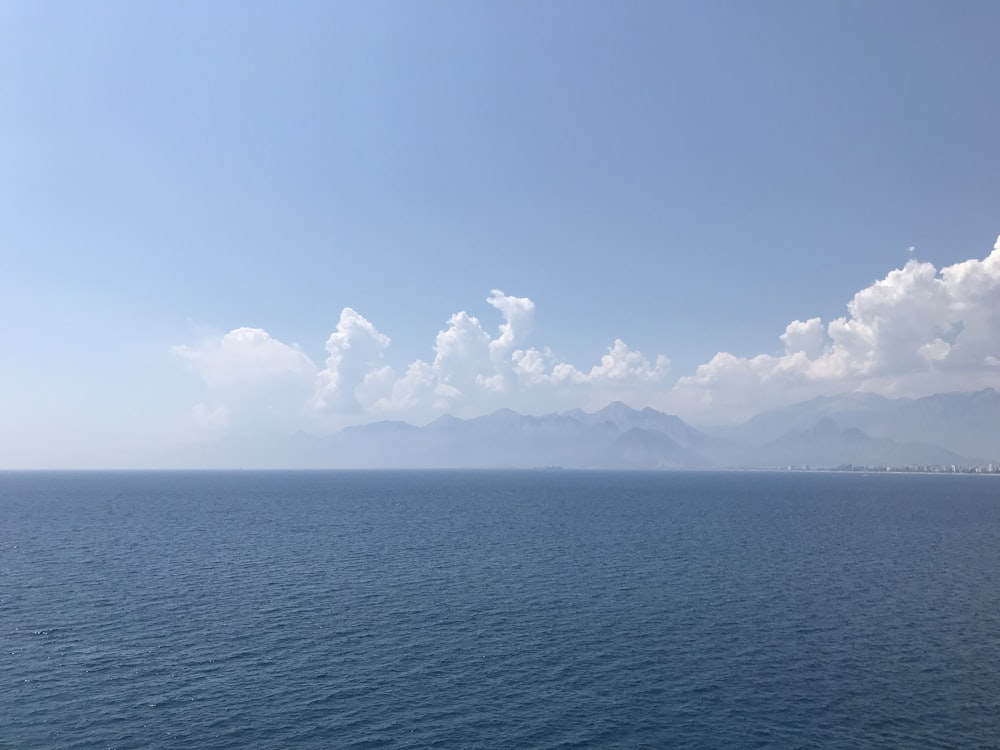 calm sea under clear blue sky