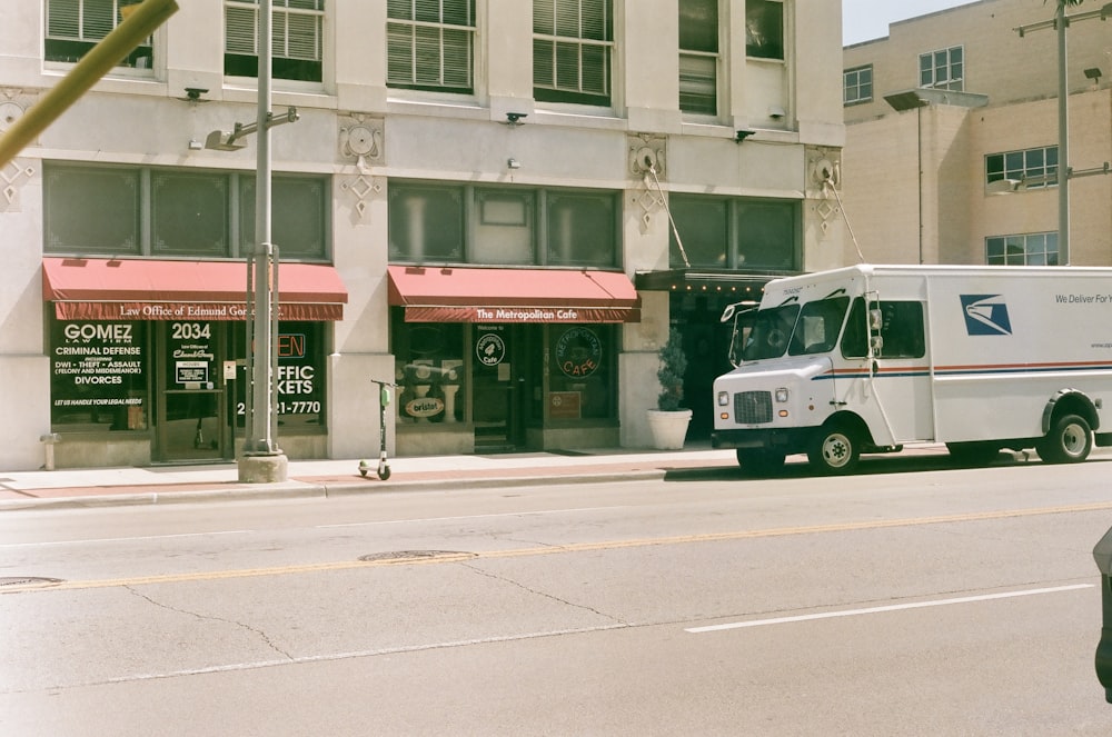 white van parked near building