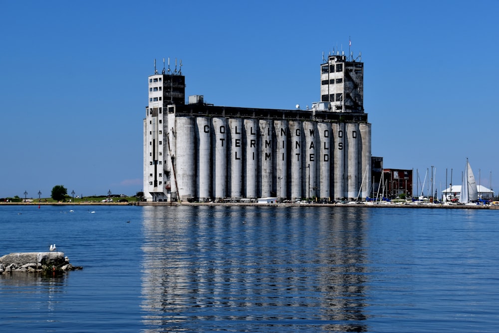white and gray building near body of water