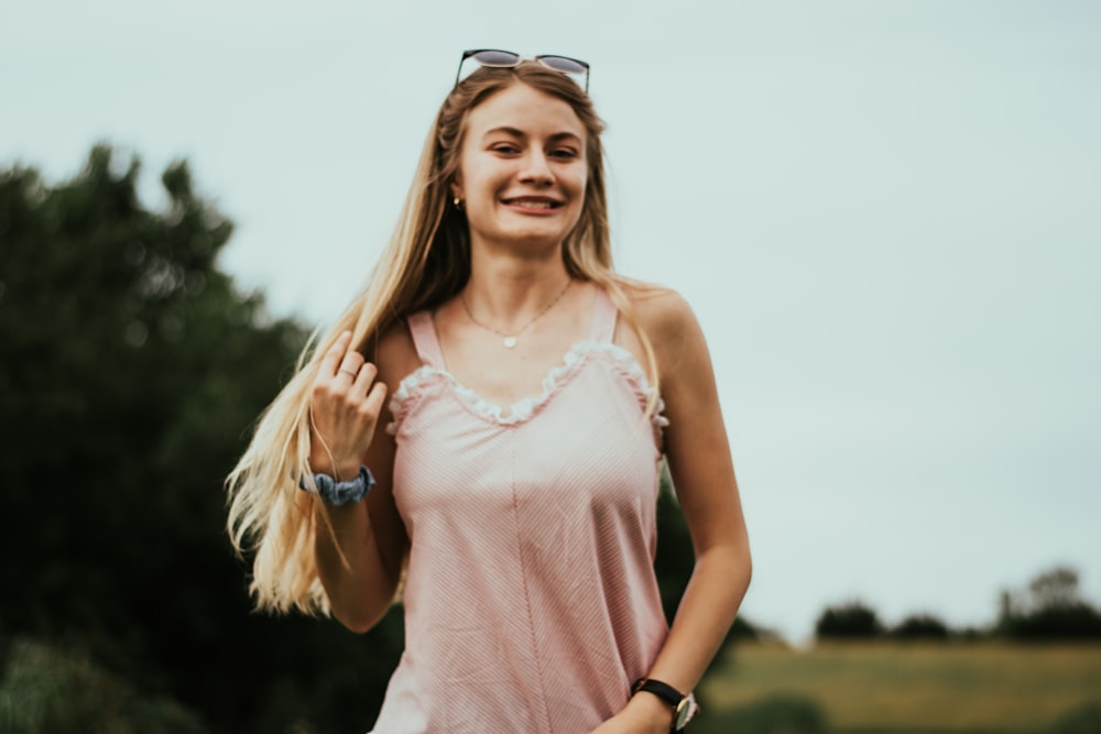 smiling woman touching her hair