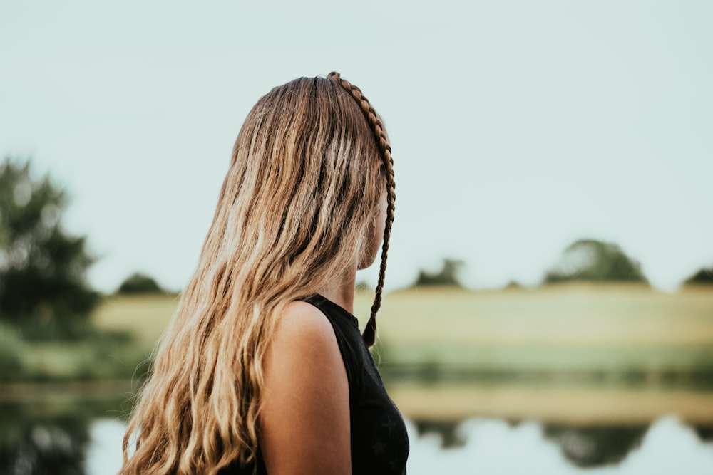 woman standing and glancing her right side