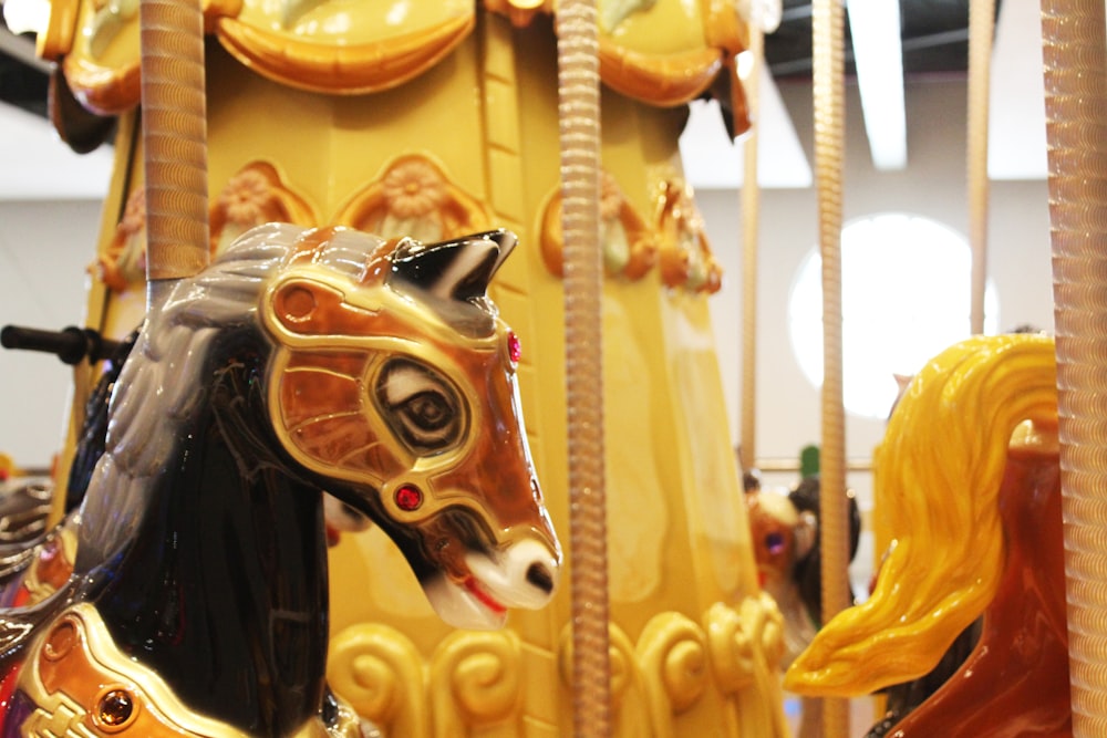 yellow and orange carousel ride