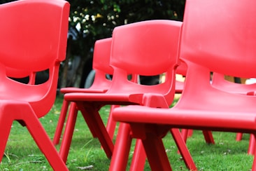 red plastic armless chair lot