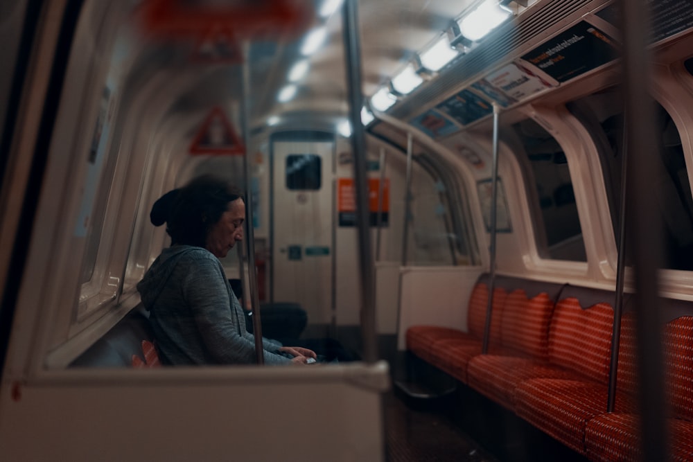 man sitting inside train