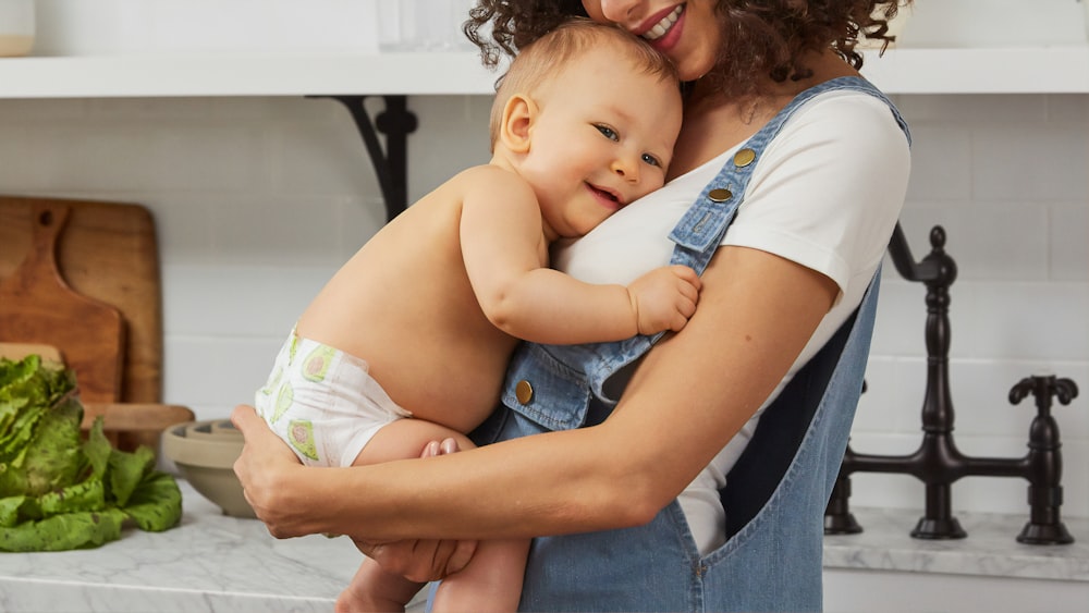 woman carrying baby