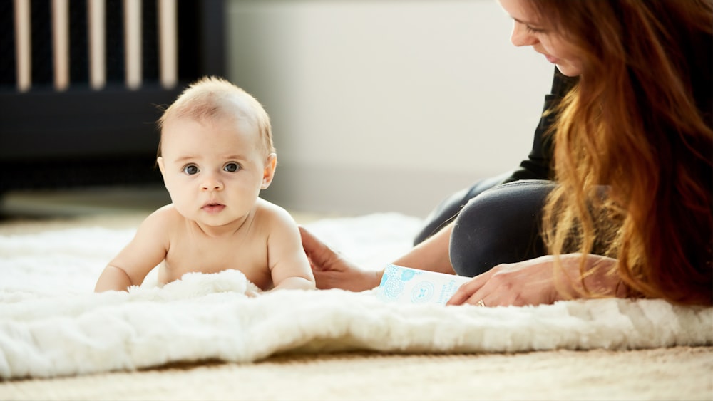 baby on a white mat