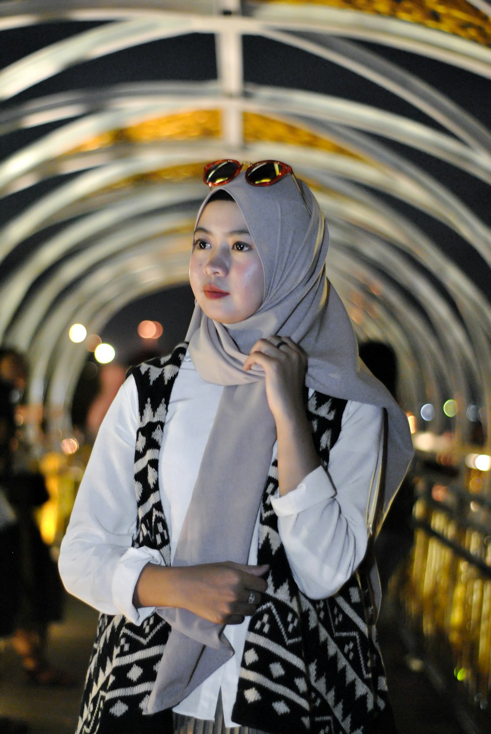 woman in grey head scarf