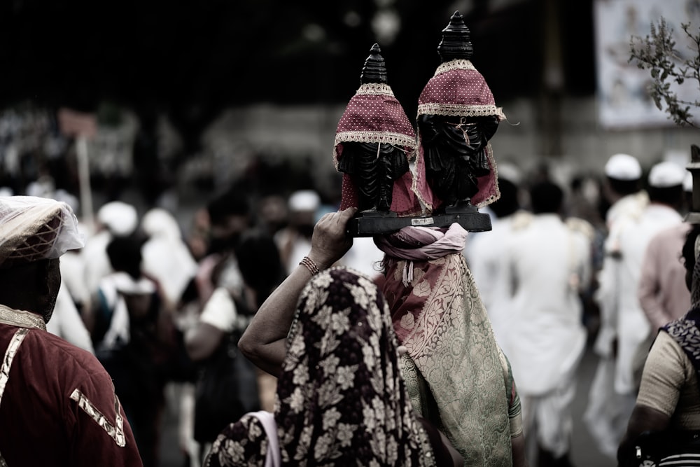 person carrying figurine