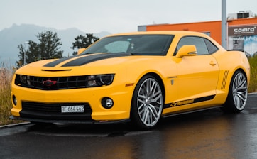yellow Chevrolet coupe close-up photography