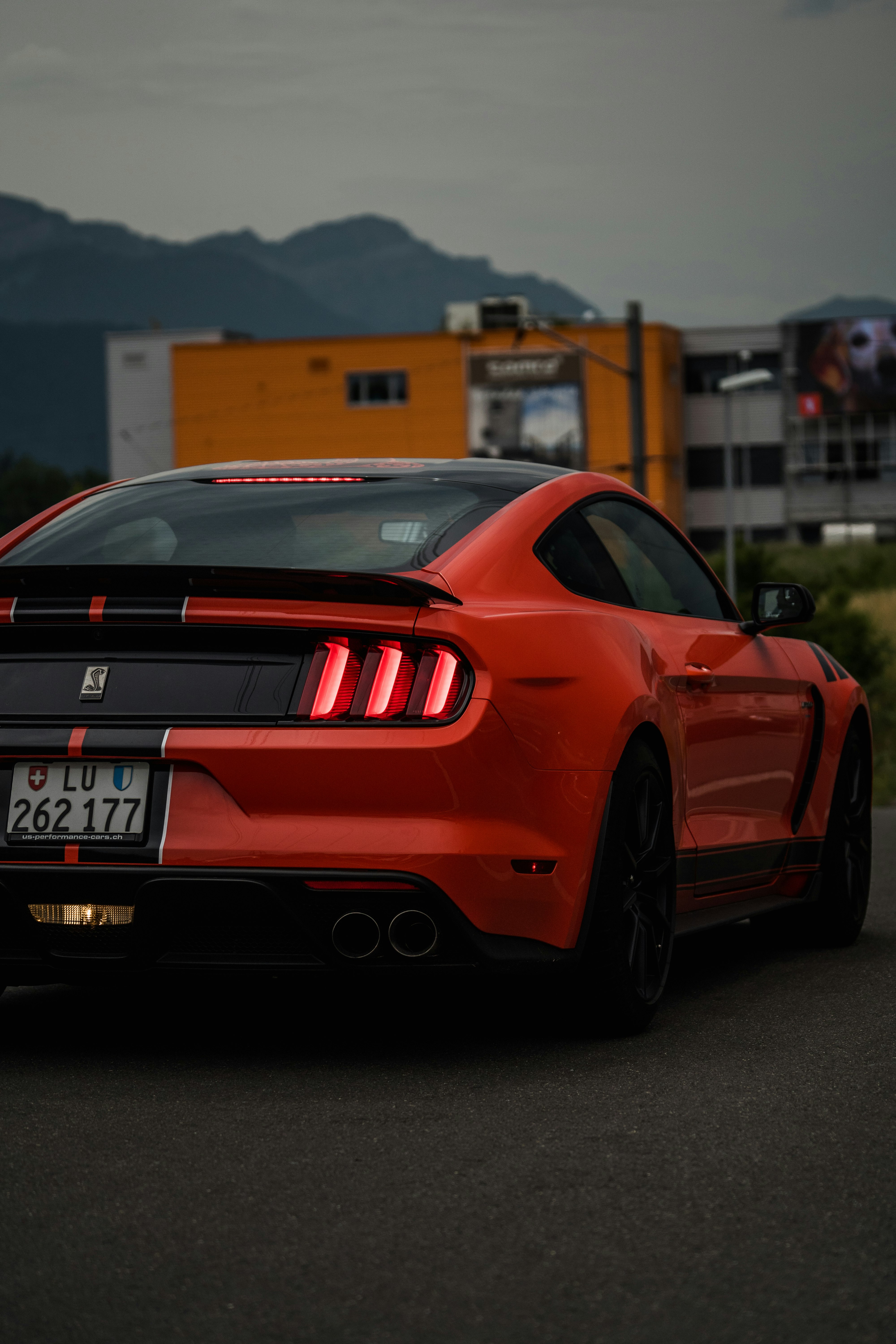 orange Ford Mustang coupe