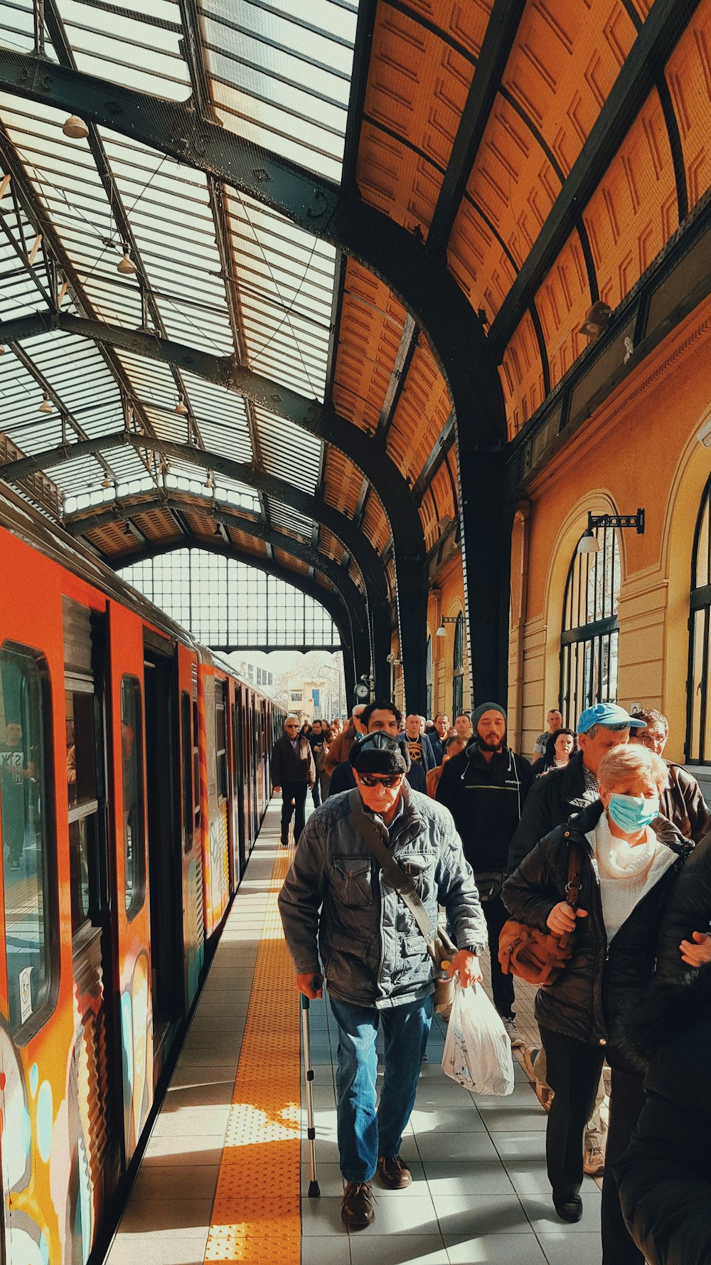 people walking beside train