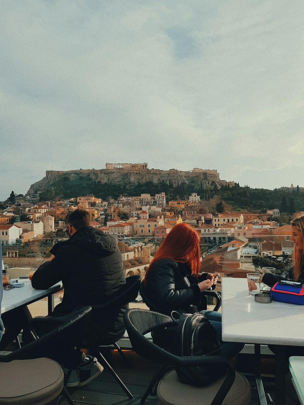 man and woman sitting on chair beside table during daytime