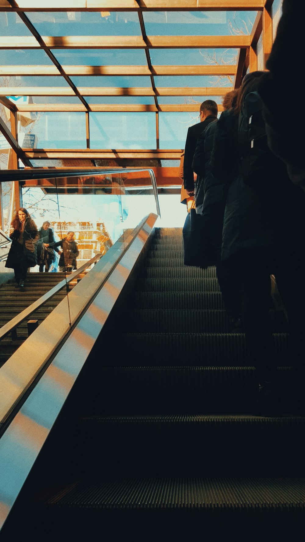 people walking on escalator