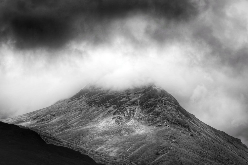 grayscale photo of foggy mountain