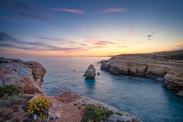 Sea stacks off the rocky coast at sunset — Menorca, Spain