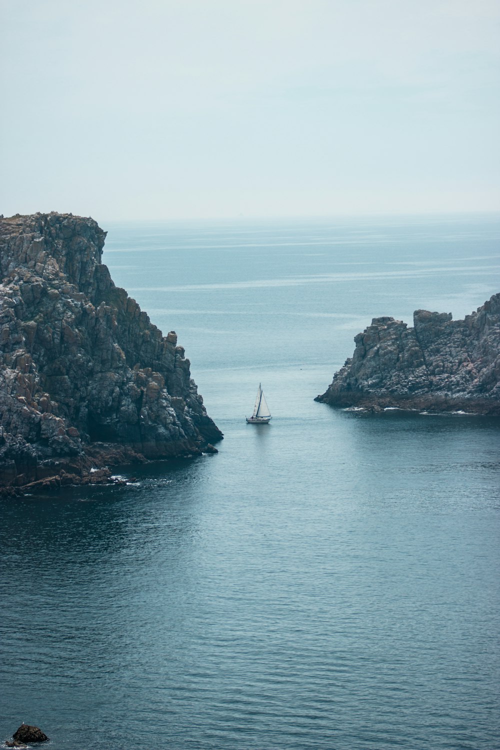 white sailboat on body of water