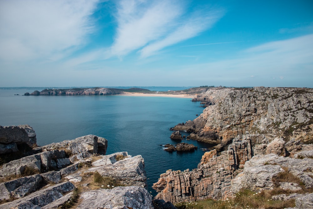 grey cliff beside ocean