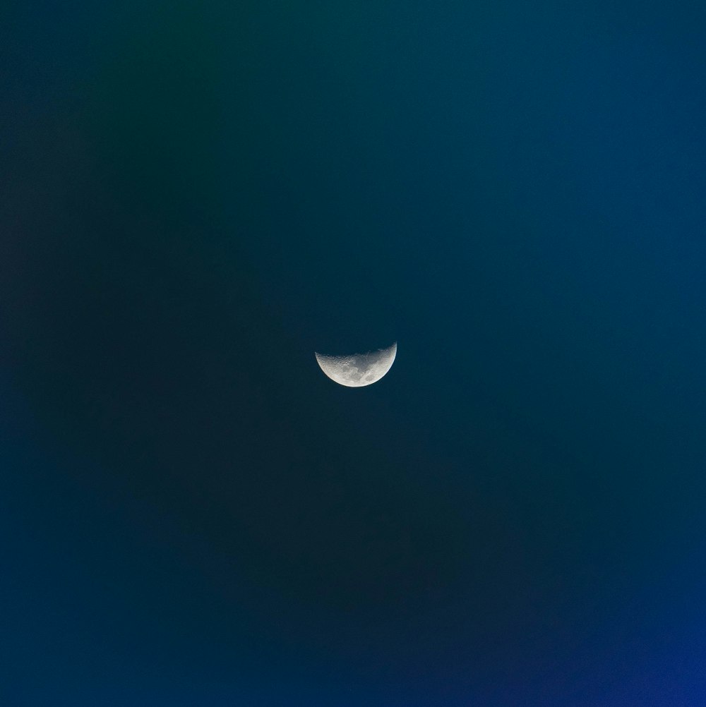white crescent moon close-up photography