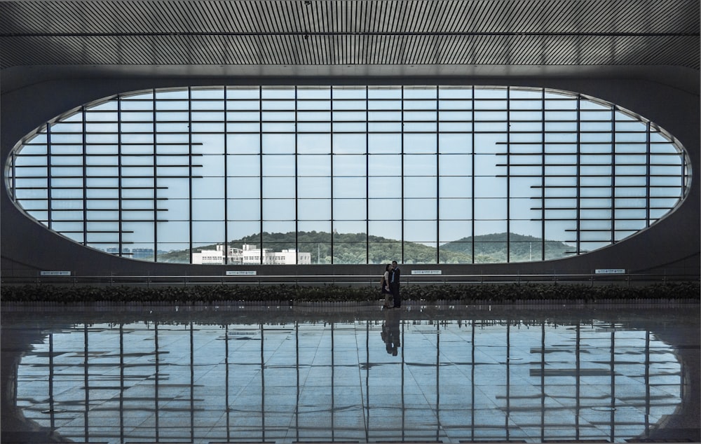 a person standing in front of a large window