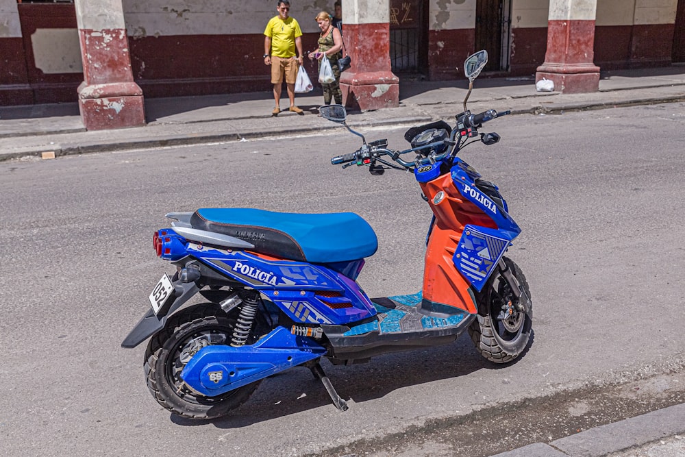 blue and orange motor scooter