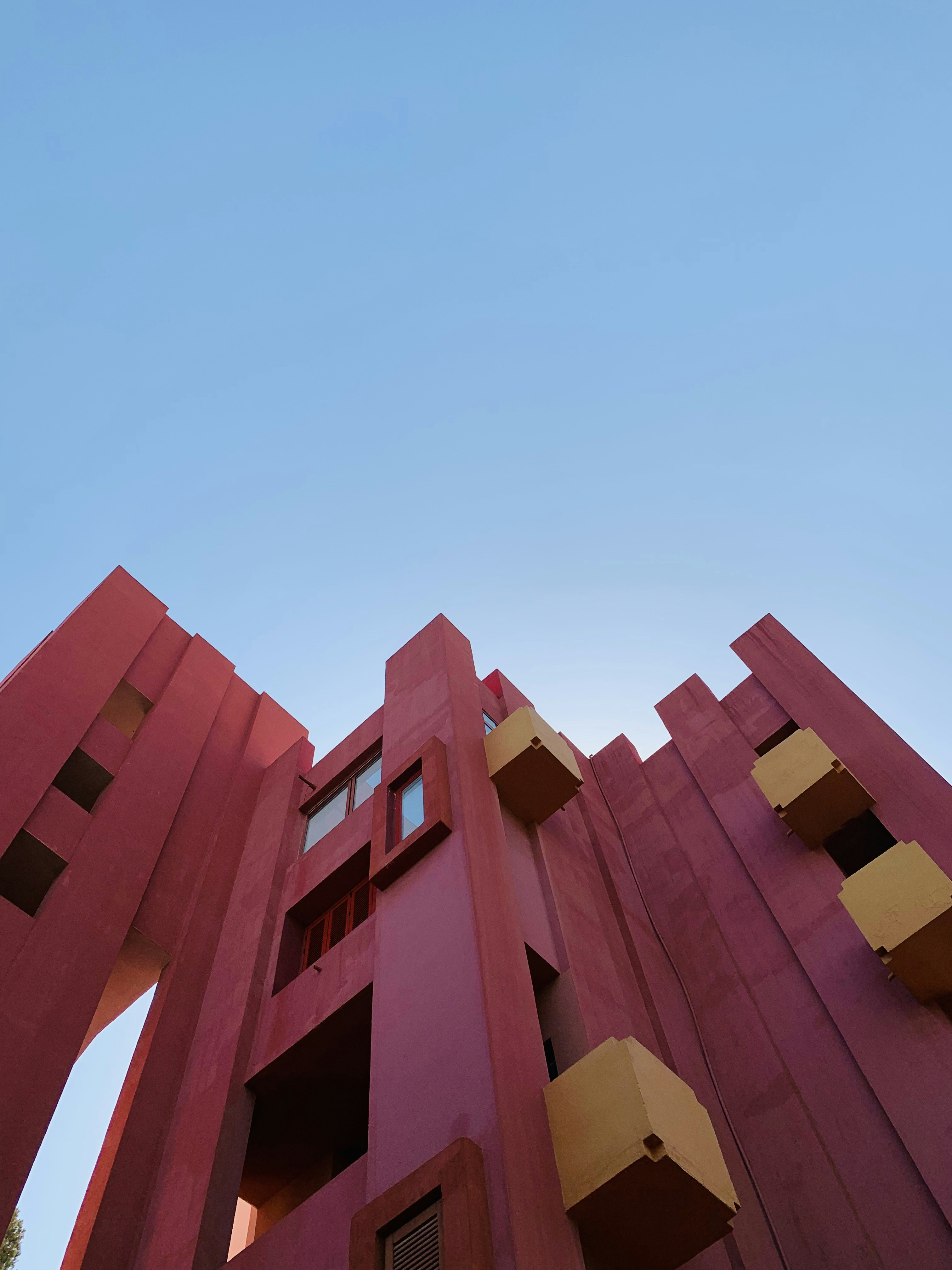 brown concrete building under blue sky