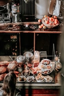 person standing beside clear display counter