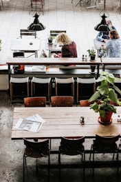 green-leafed plant in flower pot on top of table