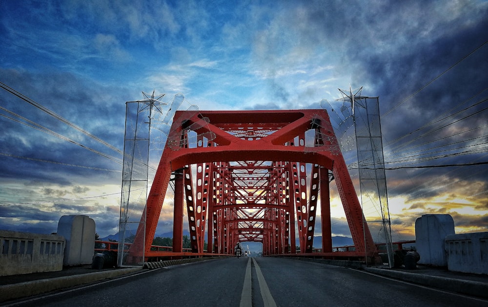 red and gray bridge at daytime