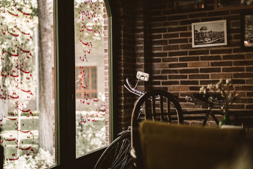 a bicycle is parked in front of a window