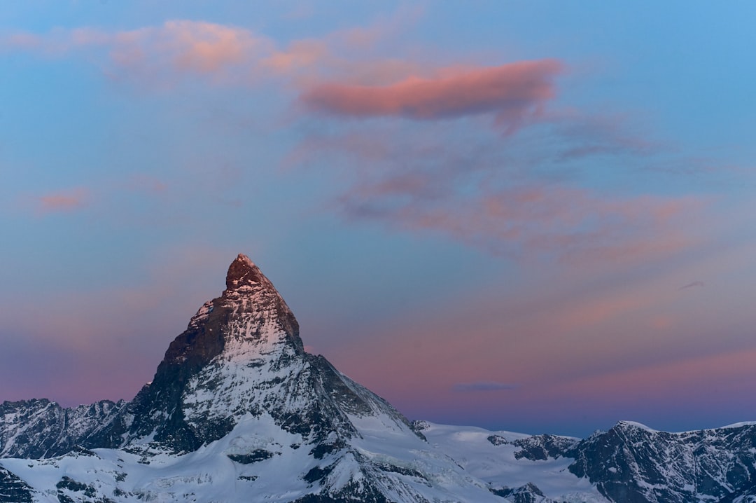 mountain peak with snow during dayrtime