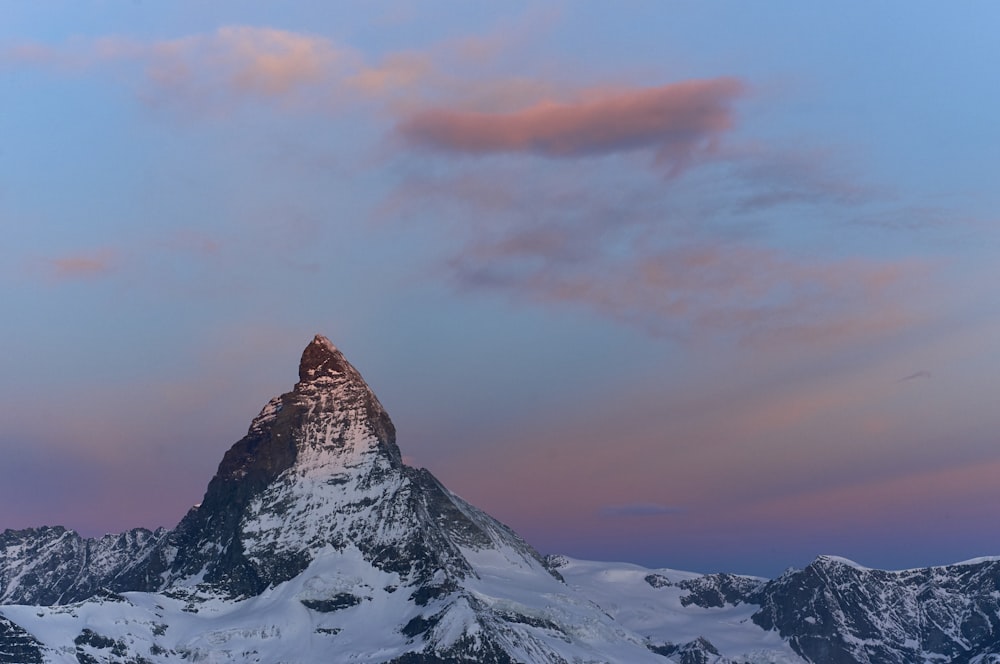 mountain peak with snow during dayrtime