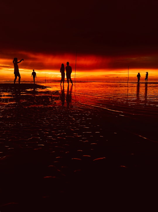 silhouette of people beside of body of water in Bongawan Malaysia