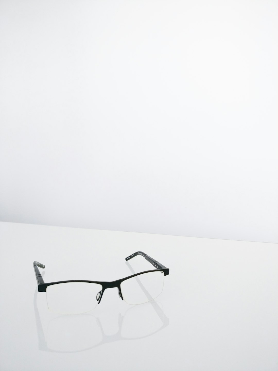 pair of black half framed eyeglasses
