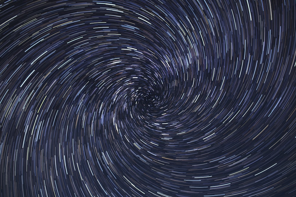a spiral of stars in the night sky
