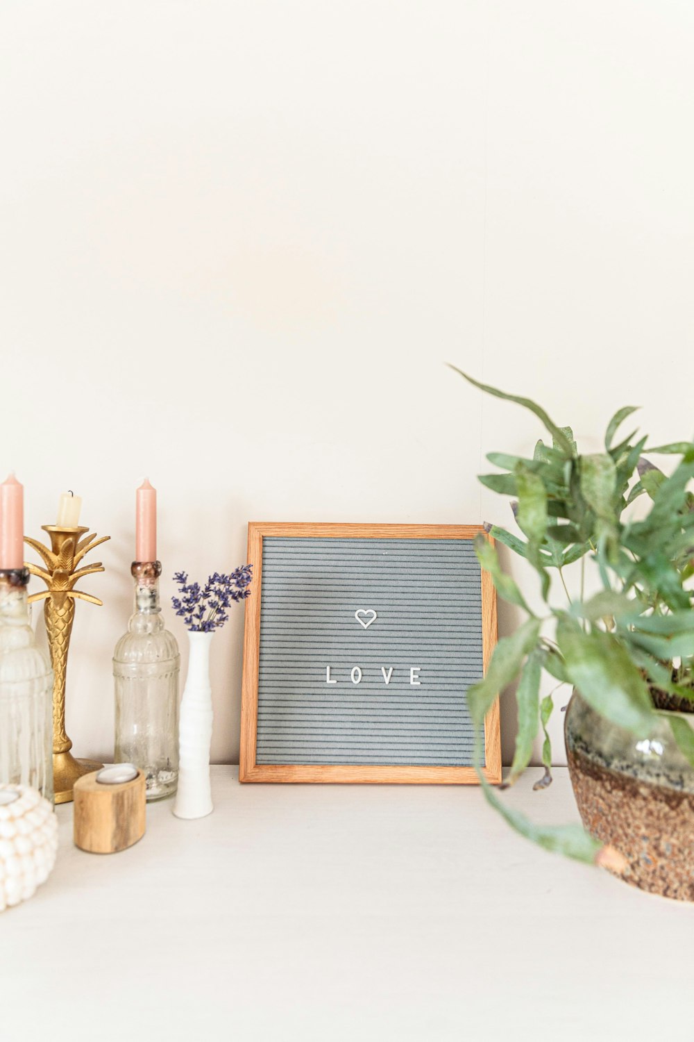 brown wooden framed grey and white Love text wall decor