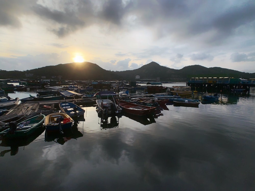 photography of canoe parked beside wooden dock during daytime