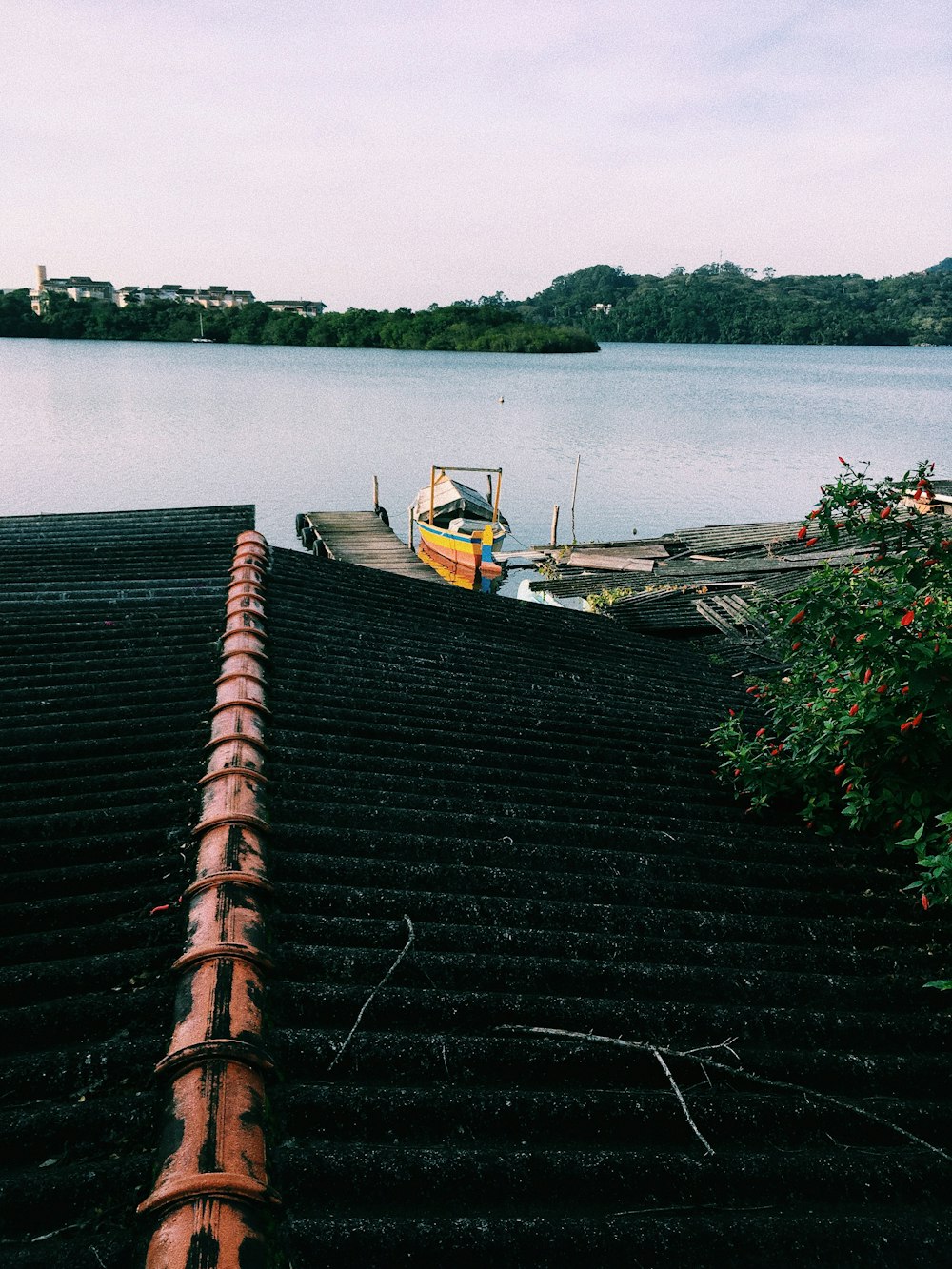 yellow canoe beside sea dock