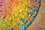 Bright mosaic tiles creating a colorful and artistic floor design.