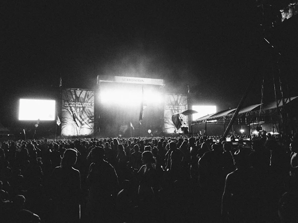 Outdoor music festival stage with crowd at night in Austin