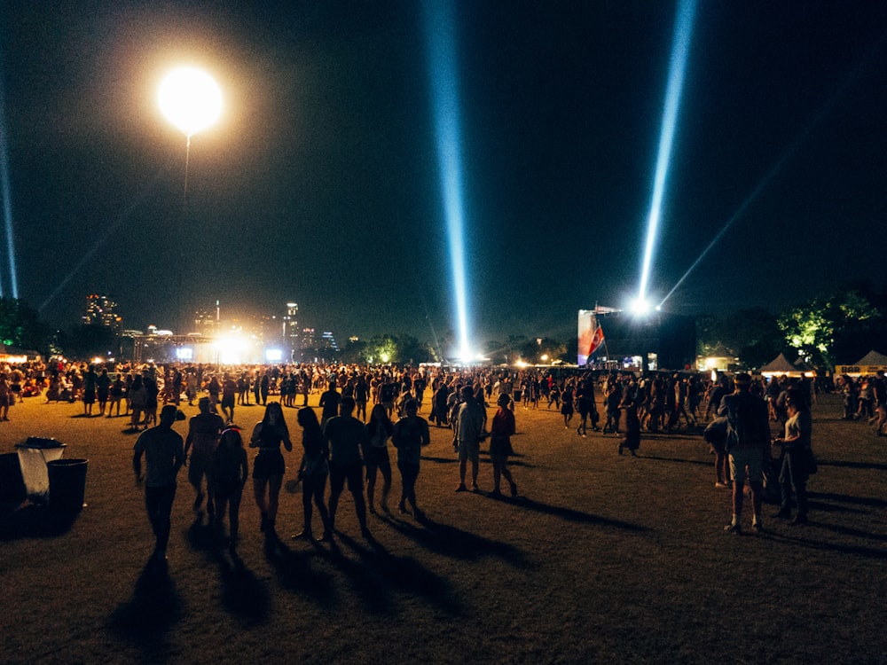 crowd of people in park at night