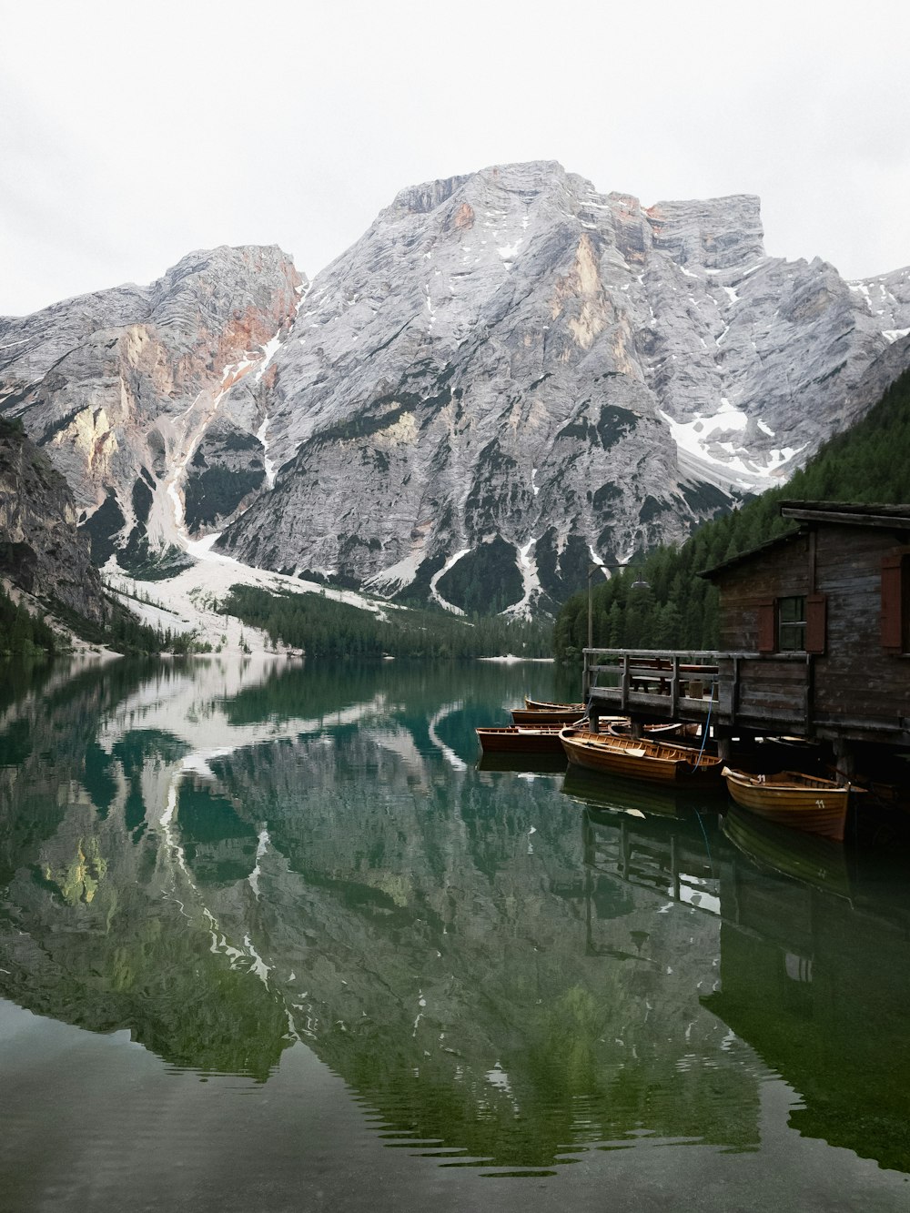 wooden house beside lake