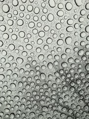 rain splattered glass panel