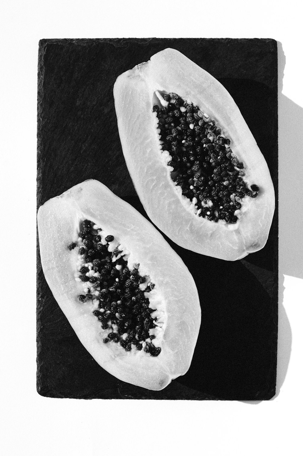 greyscale photo of sliced fruit