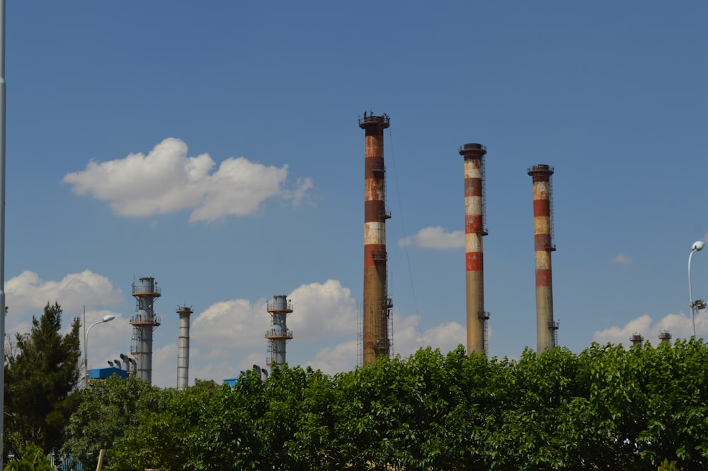 brown concrete towers under blue sky