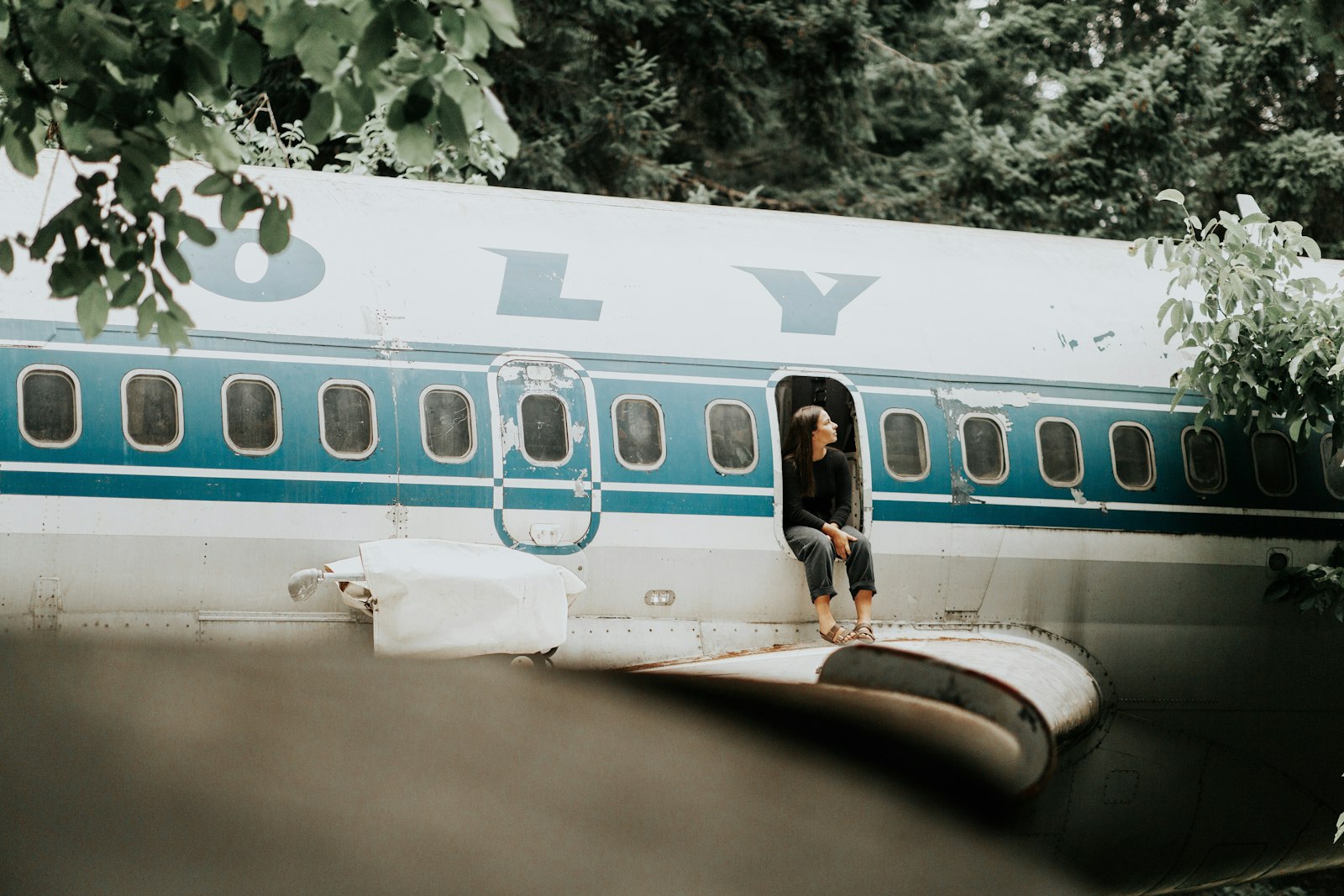 Canon EF 85mm F1.4L IS USM sample photo. Person sitting on airplane photography