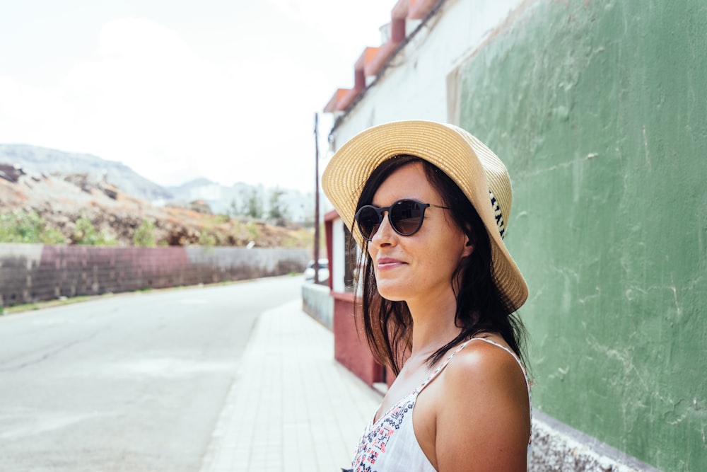 woman standing beside wall